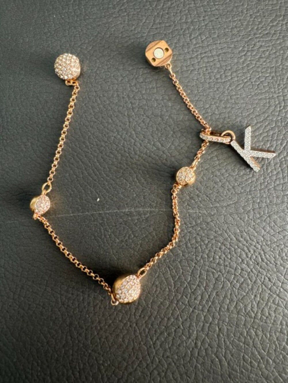 Swarovski Remix Collection pave crystal-studded spheres with "K" Charm bracelet